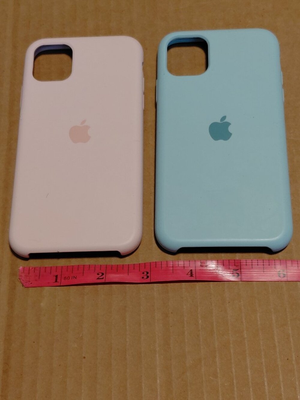 Apple silicone phone cases for the iPhone 11 Pro in light pink and seafoam green